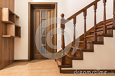 Modern brown oak wooden stairs and doors in new renovated house Stock Photo