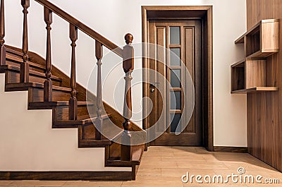 Modern brown oak wooden stairs and doors in new renovated house Stock Photo
