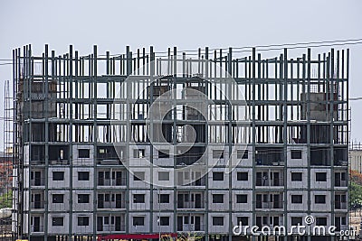 Modern Building Construction Site with Steel Pillars and Concrete Block Stock Photo