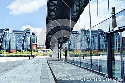 Modern building of EC1 and its reflection in glass wall of railway station Lodz Fabryczna Editorial Stock Photo