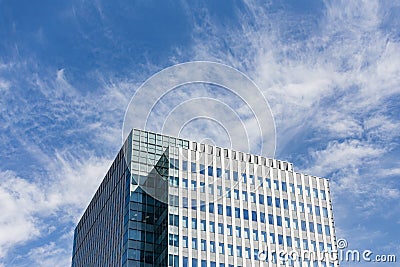 Modern building facede with rectangle and square windows form with clear blue sky with cloud in Sapporo at Hokkaido. Stock Photo