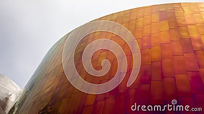 Modern Building pick and yellow metal cladding texture. Cladding background Editorial Stock Photo