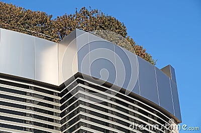 Modern building with rooftop garden . Ecology design . Stock Photo