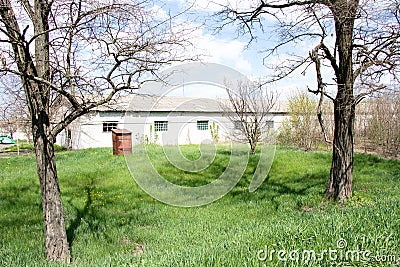 Modern buildings constructions and old buildings of mechanical tractor brigades Ukraine Stock Photo