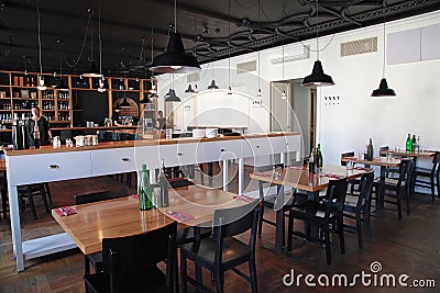 Modern cafe with cozy interior and with open kitchen Editorial Stock Photo