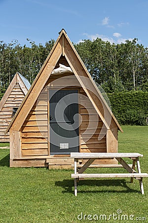 Modern camping pods and table in a field. Editorial Stock Photo