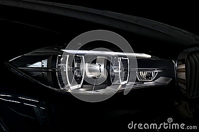 Modern car headlight with backlight. Stock Photo