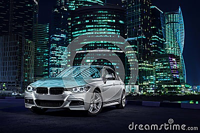 Modern car stand near Moscow City district at night Stock Photo