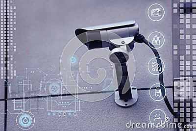 Modern CCTV security camera on building wall and icons Stock Photo