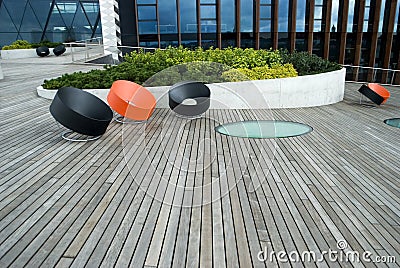 Modern chairs on the wooden public terrace Stock Photo