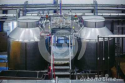 Modern cheese factory, stainless steel milk processing tanks Stock Photo