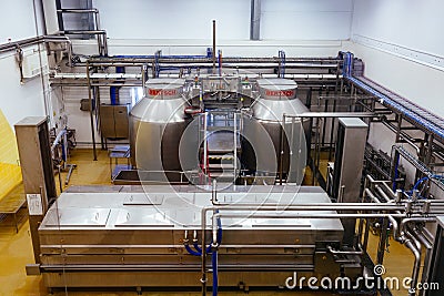 Modern cheese factory, stainless steel milk processing tanks Stock Photo