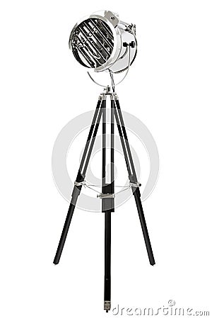 Modern chrome floor lamp with three black wooden legs, isolated Stock Photo