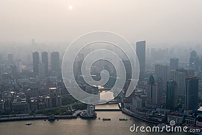 Modern city in a pollution at sunset (Shanghai, China) Editorial Stock Photo