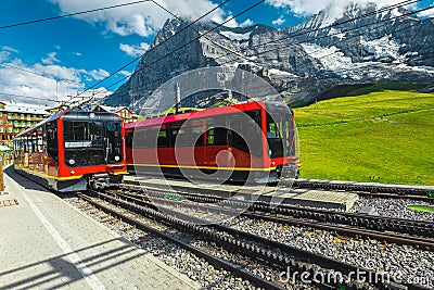 Modern cogwheel tourist trains waiting in the train station, Grindelwald, Switzerland Stock Photo
