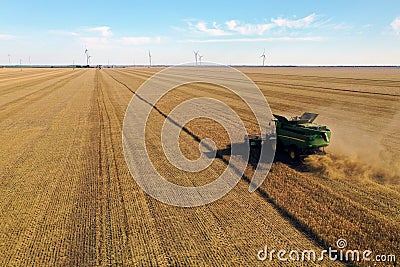 Modern combine harvester working in field. Agriculture industry Editorial Stock Photo