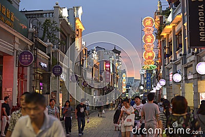 Modern commercial city street, urban shopping street with crowded people, street view of China Editorial Stock Photo