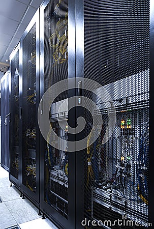 Modern communication center with technical row of cellular data terminal. Radio station interior. Backhaul network equipment under Stock Photo