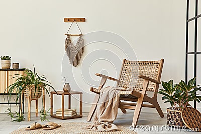 Modern composition of living room interior with design armchair, loft wall, stool, decoration, plants, macrame. Stock Photo