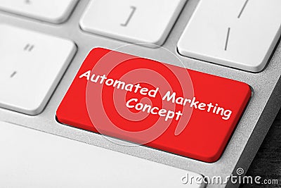 Computer keyboard with text AUTOMATED MARKETING CONCEPT on button, closeup Stock Photo