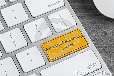 Computer keyboard with text AUTOMATED MARKETING CONCEPT on table, closeup Stock Photo