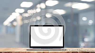 Modern computer,laptop with blank screen on counter barretail store shopand glass wall office Stock Photo