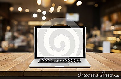 Modern computer,laptop with blank screen on table with blur cafe Stock Photo