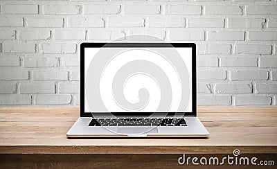 Modern computer,laptop with blank screen on wall brick Stock Photo