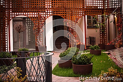 Modern cozy beautiful town yard with green lawn Stock Photo