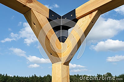 A modern cubic playground made of wooden logs and metal corners, visible steel corners. Stock Photo
