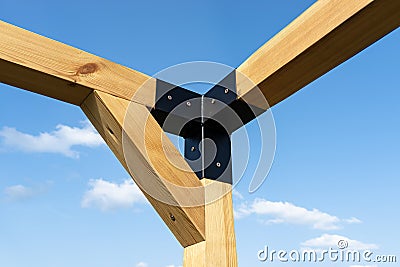 A modern cubic playground made of wooden logs and metal corners, visible steel corners. Stock Photo