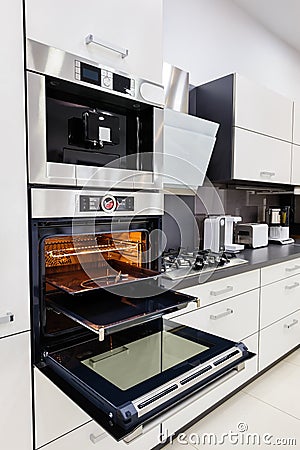 Modern custom hi-tek kitchen, oven with open door Stock Photo