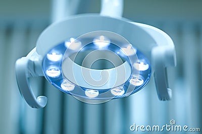 Modern dental lamp in dental clinic. Lamp in operational room. Stock Photo