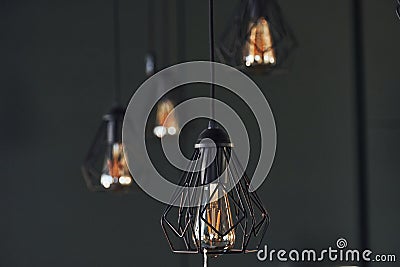 Modern designed light bulbs hangs on the wall indoors. Decoration and domestic life Stock Photo