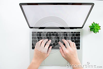 Modern desks have the hands of women using a laptop computer. Top view Stock Photo