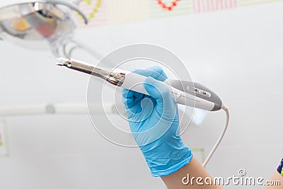 Modern device in the hands of a dentist for anesthesia in dentistry Stock Photo