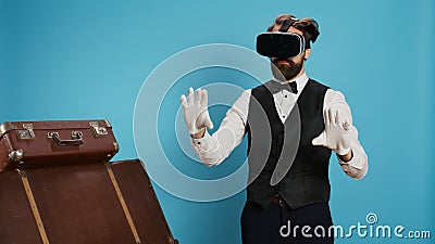 Modern doorman using vr glasses Stock Photo