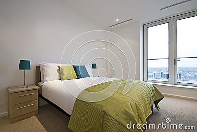 Modern double bedroom with king size bed Stock Photo