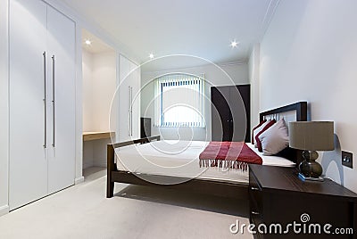 Modern double bedroom with king size bed Stock Photo