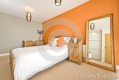 Modern double bedroom with solid wooden furniture Stock Photo