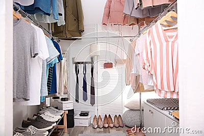 Modern dressing room with different stylish clothes Stock Photo