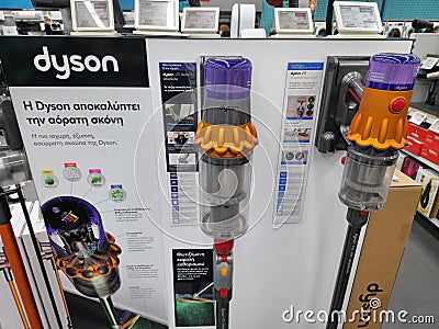 Modern Dyson handheld upright cordless vacuum floor cleaners on display Editorial Stock Photo