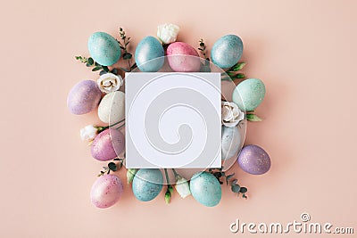 Modern Easter mockup with white blank and colorful Easter eggs with flowers. Flat lay Stock Photo