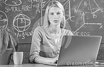 Modern education. Back to school. Remote education. Student adorable blonde girl classroom chalkboard background. STEM Stock Photo