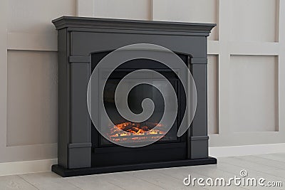 Modern electric fireplace near light wall indoors Stock Photo