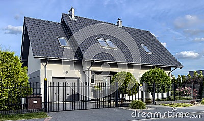 Modern elegant private house in Poland with an elegant metal fence Stock Photo