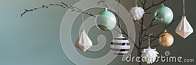 Modern and elegant simple nordic christmas tree decorations in black, white, gold and turquoise Stock Photo