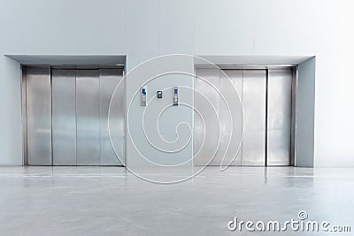 Modern Elevator and Interior Decoration of Lobby Entrance Flooring, Steel Door Accessibility Gate Elevator of Office Building. Stock Photo