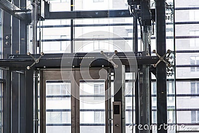 Modern elevator made of steel and transparent glass Stock Photo