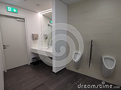 Modern empy bathroom with Urinal Stock Photo